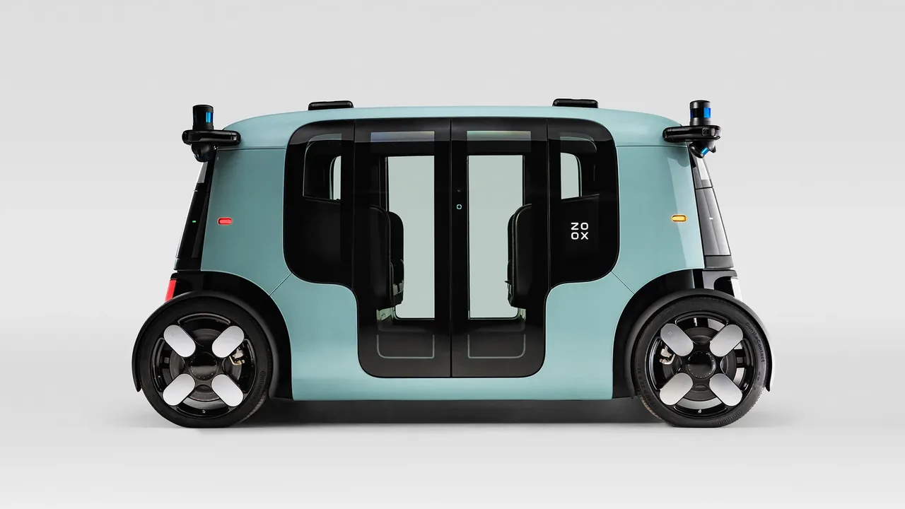 Side view of a driverless robotaxi with roof-mounted lidar and camera sensor pods